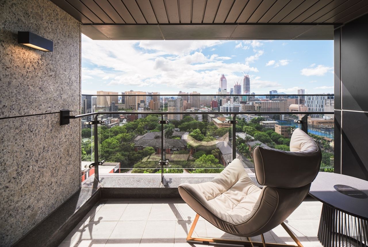 A balcony overlooking the city — ESTIA
